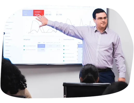 LYFE Marketing account manager presenting a digital marketing ROI report and social media growth metrics to a client during a strategy session.
